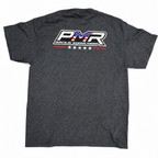 A dark heather gray t-shirt shown from the back, featuring a large graphic print of 'PMR RACE & SPEED SHOP' with an American flag pattern inside the letters and five stars below.