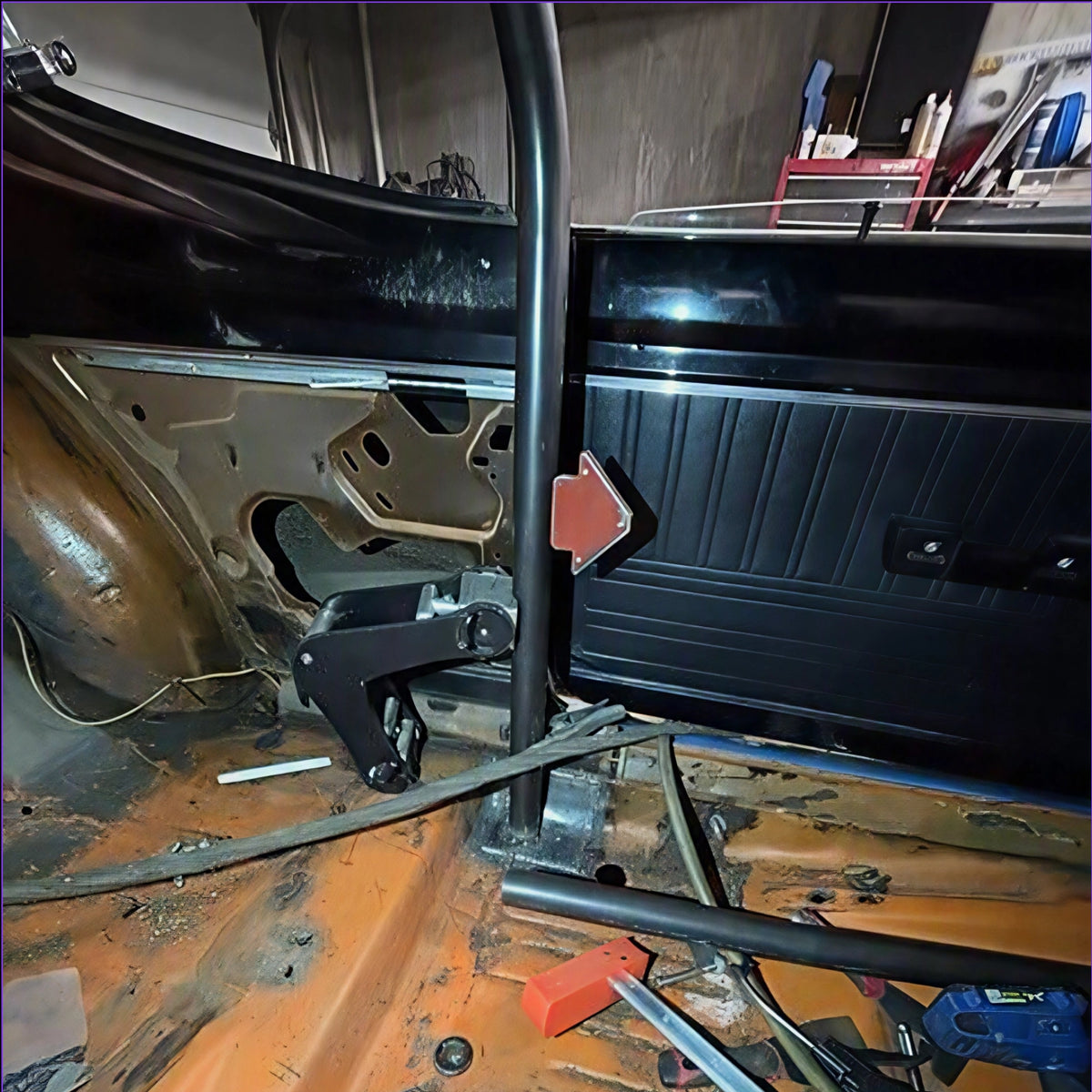 A PMR chromoly main hoop being installed n a Plymouth Duster