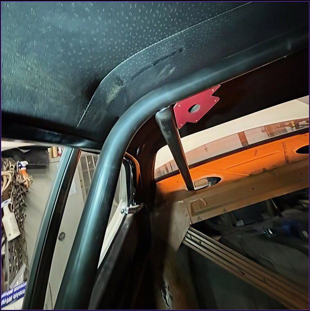 A PMR NHRA chromoly main hoop being installed n a Plymouth Duster