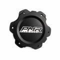 A black anodized aluminum fuel cell cap with a white and black PMR logo in the center and pre-drilled bolt holes around the outer rim, shown on a white background.