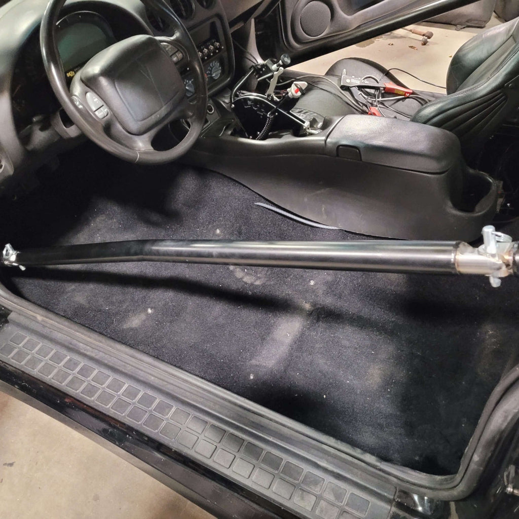 PMR Triple Shear Swing-Out Door Bar Kit Installed in a 6pt Roll Cage Kit with the Bar Attached