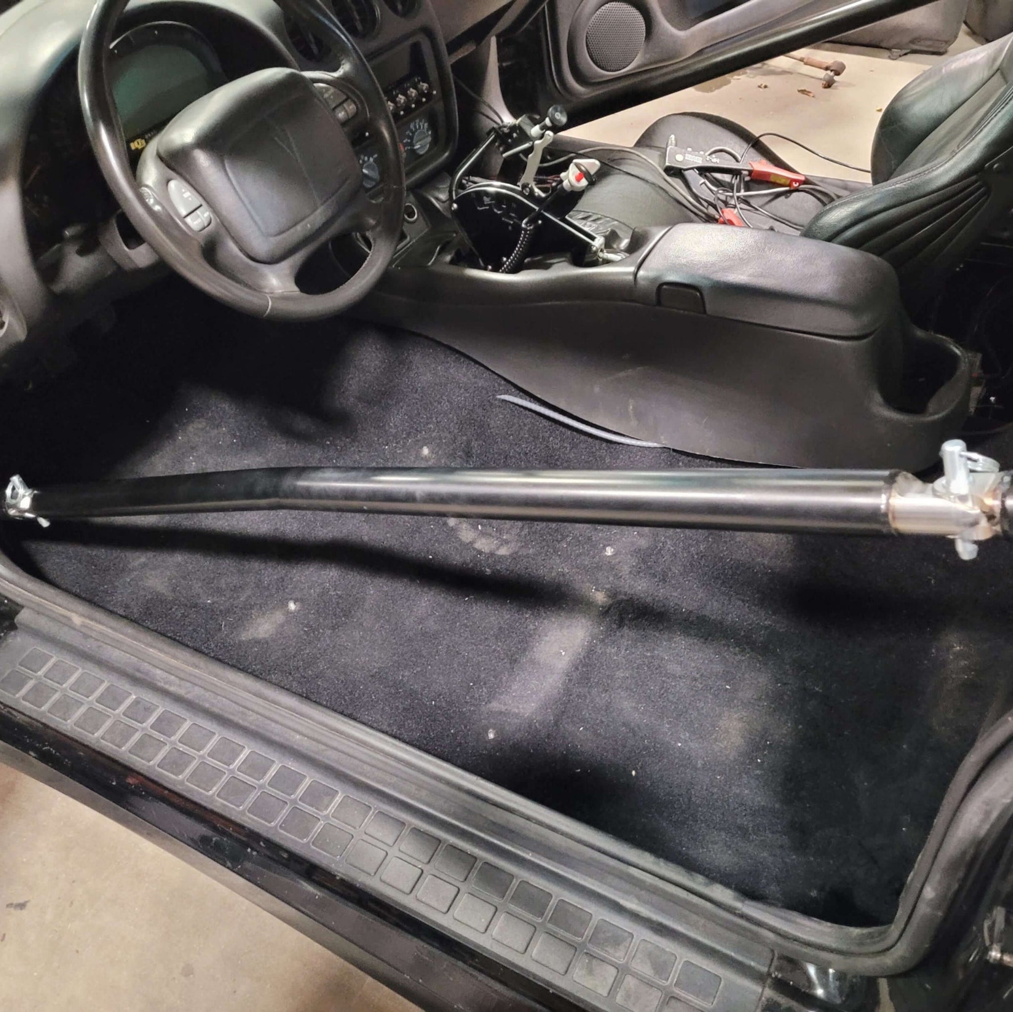 PMR Triple Shear Swing-Out Door Bar Kit Installed in a 6pt Roll Cage Kit with the Bar Attached
