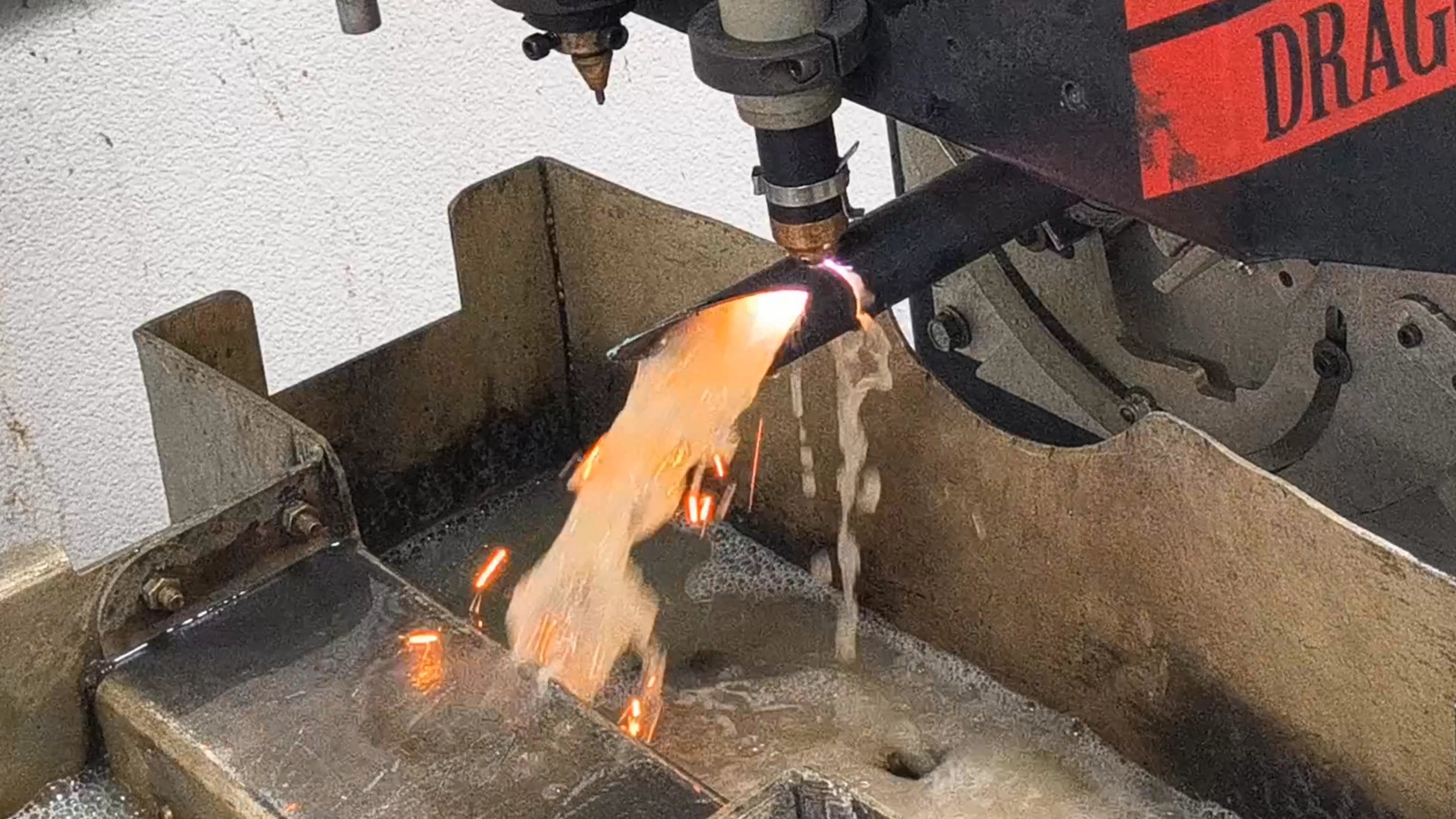 Chromoly tube being plasma cut in the PMR fabrication shop for a roll cage kit.